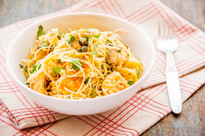 healthy chicken piccata with cilantro as garnish. healthy pasta recipes