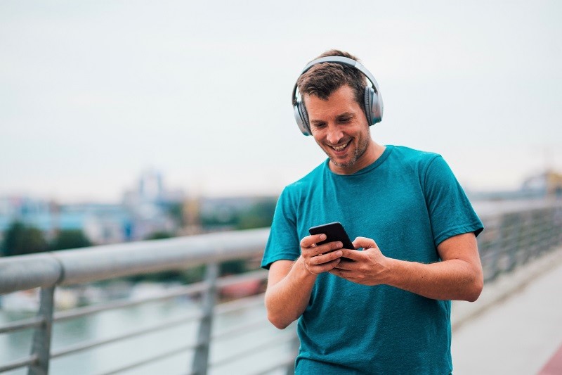 man listening to music while walking