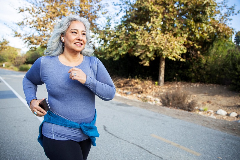 Woman power walking on the street to burn more calories