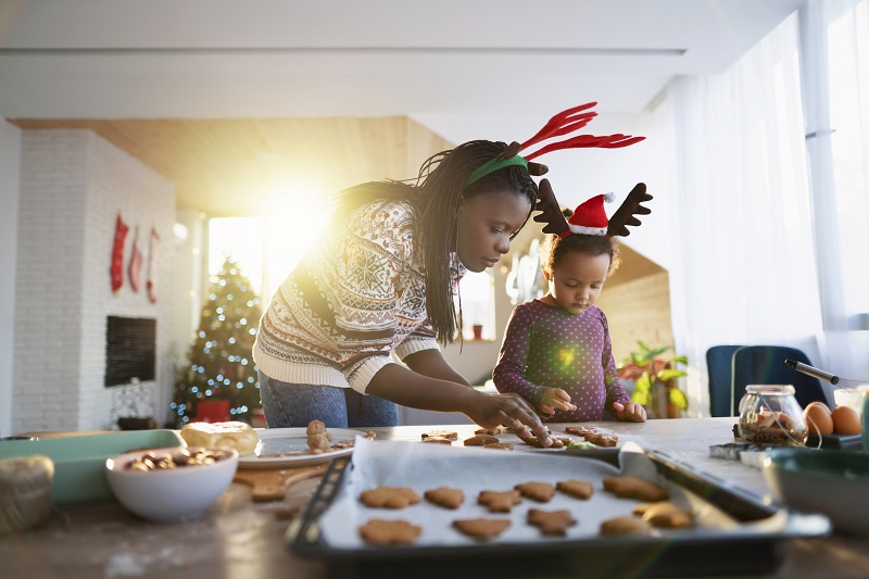 mom and daughter baking cookies. holiday activities