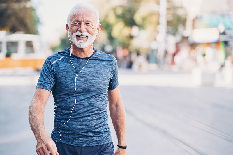 a healthy older man exercising outside