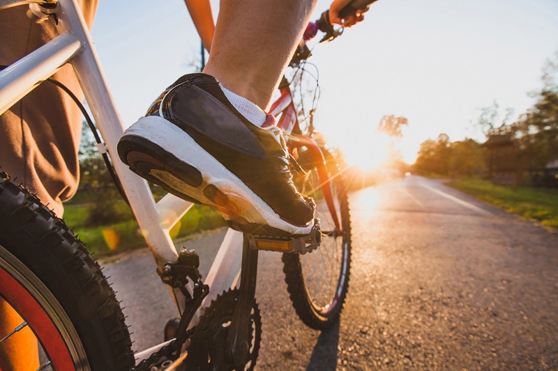 a closeup of a mans bike as he cycles